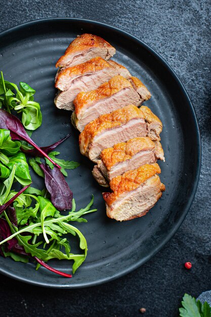 duck breast fried and salad leaves portion grill or barbecue roasted meat poultry