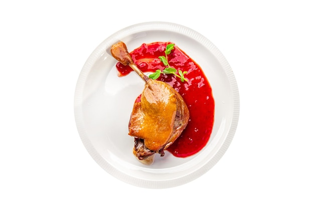 duck confit leg, red berry sauce  meal food snack on the table copy space food background