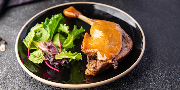 duck confit leg, red berry sauce  meal food snack on the table copy space food background