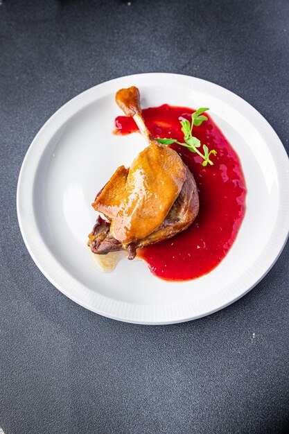 duck leg confit berry sauce second course healthy meal food snack diet on the table copy space food