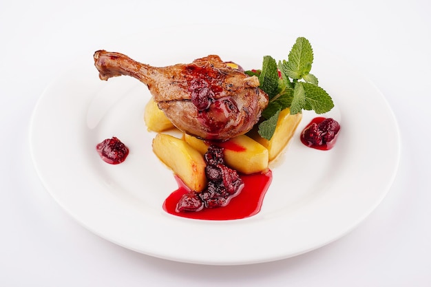 Duck leg with potatoes and raspberry jam