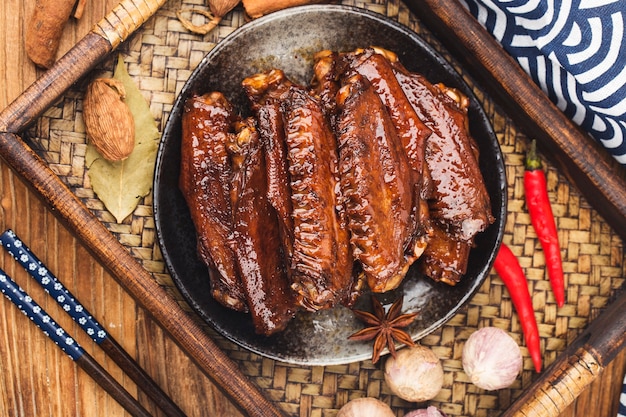 The duck's wings were boiled and placed on a  plate