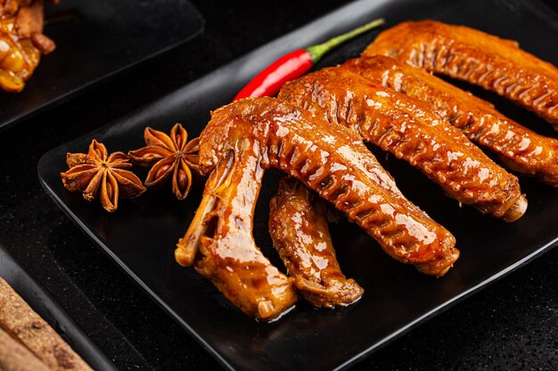 The duck's wings were boiled and placed on a plate