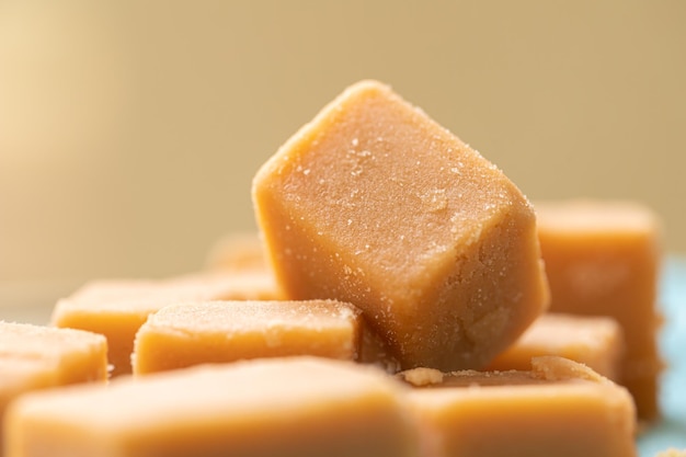 dulce de leche cube-shaped in macro photograria