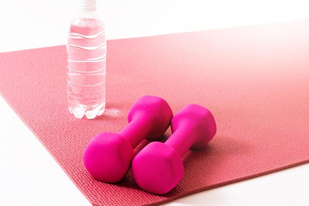 Photo dumbbells and yoga mat