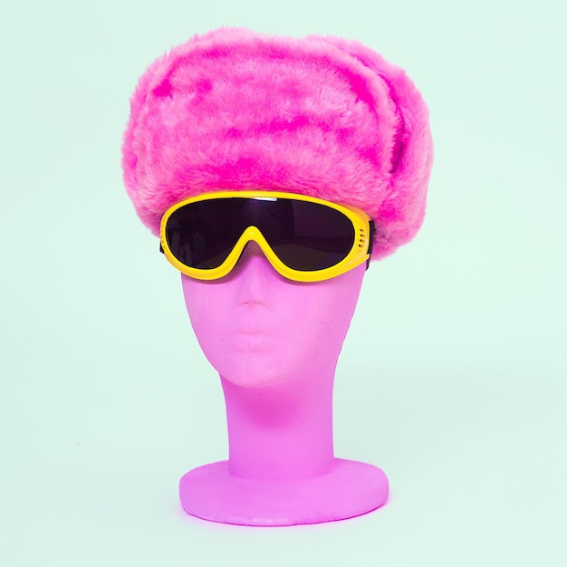 Dummy fashion in stylish sport sunglasses and fur hat Snowboard winter style Sale and shopping trendy accessories concept