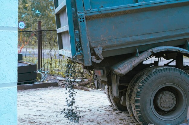 Dump trucks carrying good filling a field giving rise to a fine soil Preparation and construction