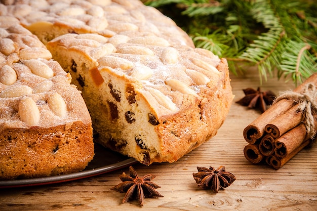 Dundee cake on an old rustic wooden table