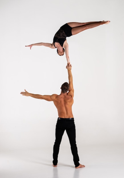 Duo Of male and female Acrobats Showing hand to hand Trick