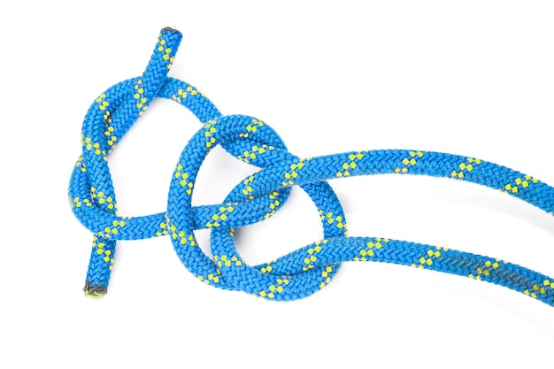 Durable colored rope for climbing equipment on a white background knot of braided cable item for tourism and travel