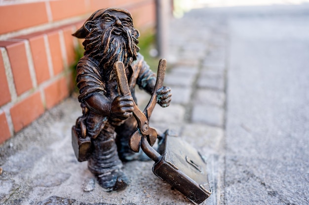 Dwarf with a padlock near bridge