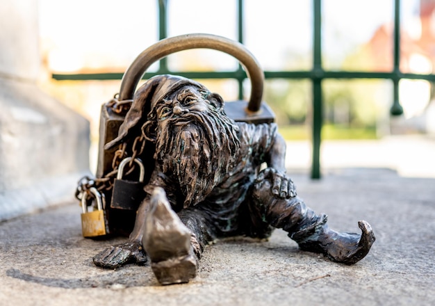 Dwarf with a padlock near bridge