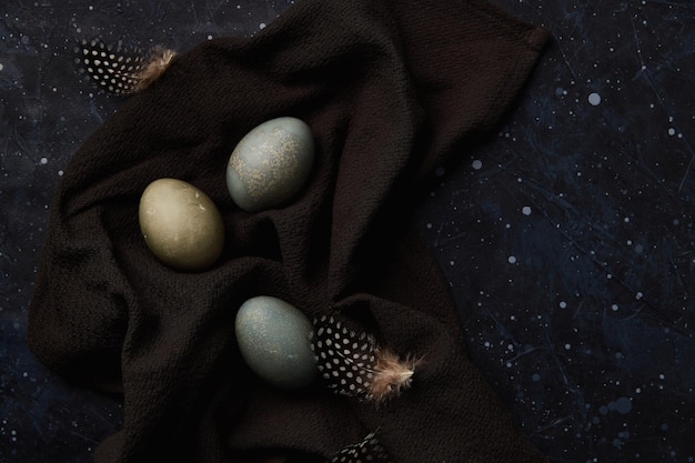 Dyed eggs on black background easter celebration concept