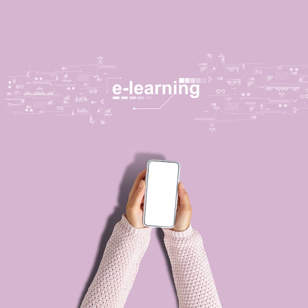 E-learning concept. Hands hold a smartphone on a pink background.