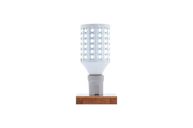 E27 230v screw-cap LED energy-saving lamp on a wooden base isolated on white background.