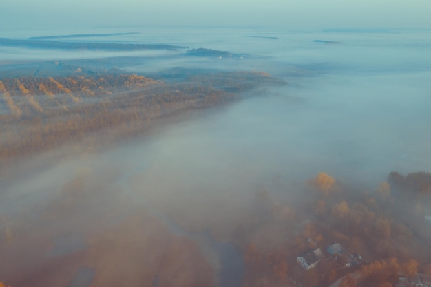 Early foggy morning Aerial view of countryside and country road