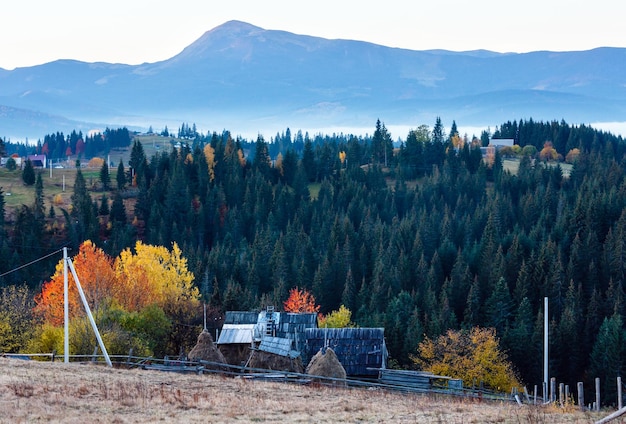 Early morning misty autumn Carpathian mountain village Ukraine