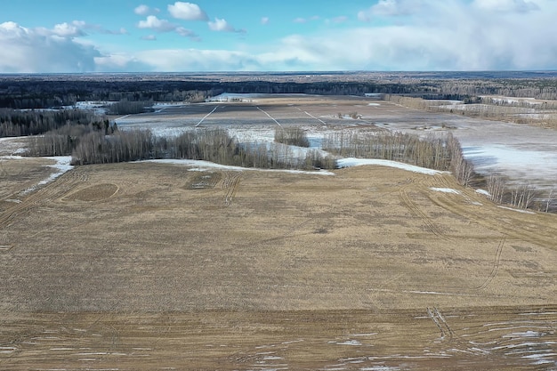 early spring field top view drone, abstract landscape flight