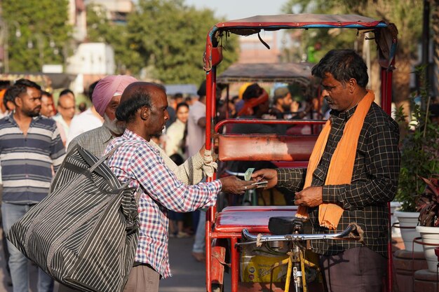 Earning of rickshaw driver giving money CP New Delhi Delhi India 14 Jan 2023