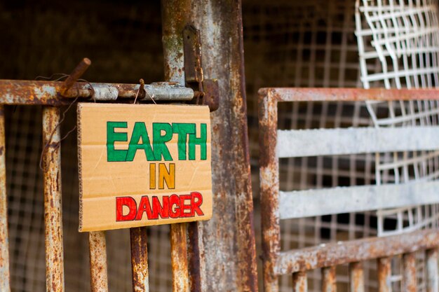 Earth In Danger title on cardboard