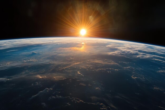 Photo earth from space during sunrise with glowing horizon and beautiful clouds