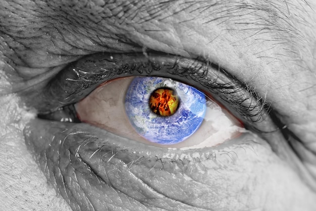 The earth globe inside of a man39s eye the concept of the destruction of the earth in the human eye