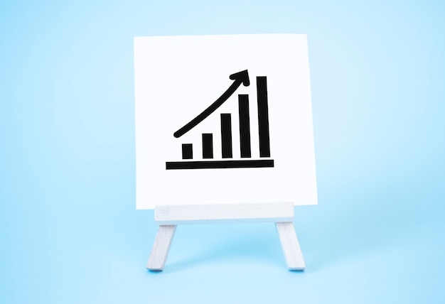 Easel and up arrow chart. Concept of success, growth and performance improvement. Statistics and business analytics. Income revenue