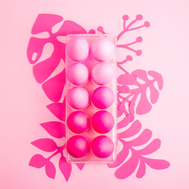 Easter 2019 with eggs painted in pink color on a monochrome background