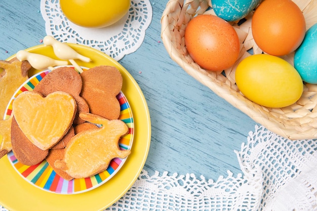 Easter backdrop with colored eggs and homemade cookies