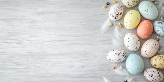 Easter background with colorful eggs and feathers on a wooden table