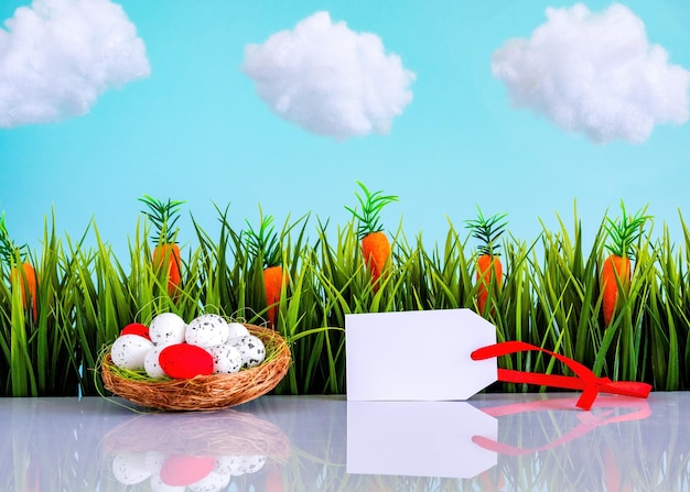 Easter background with colorful eggs green grass tag and blue sky with white clouds