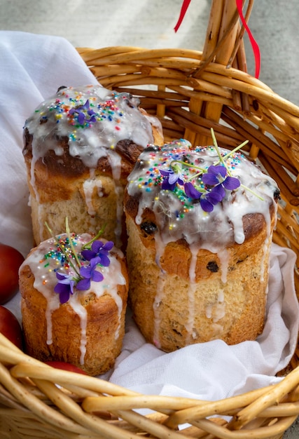 Easter bread with flowers on top in basket. Christian holiday preparation