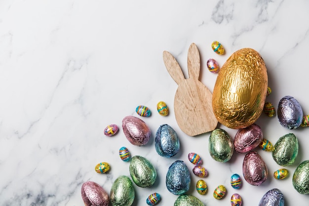 Easter bunny with foil wrapped chocolate easter eggs