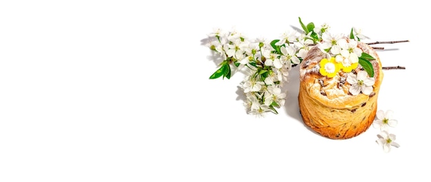 Easter cake Cruffin or sweet bread kulich and traditional painted eggs Baking and cherry flowers