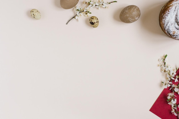 The Easter cake is decorated with powdered sugar painted eggs on a beige background