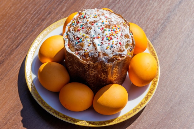 Easter cake and painted eggs on a table