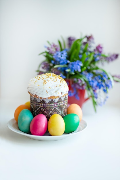 Easter cake with painted eggs on the table