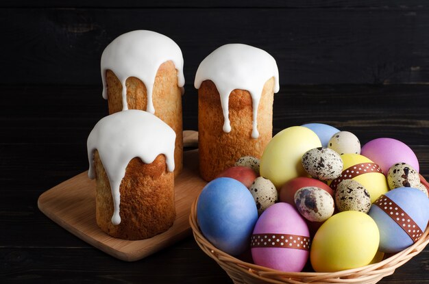 Easter cakes and chicken, quail eggs on a dark background