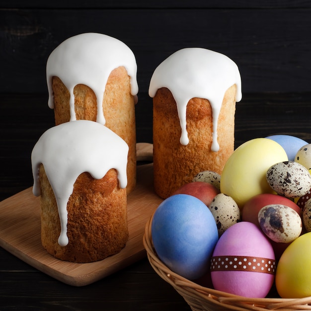 Easter cakes and chicken, quail eggs on a dark background