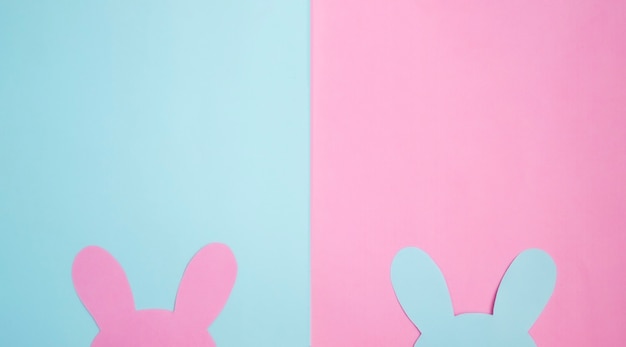 Easter card with Easter Bunny. Composition in pastel pink and blue tones background