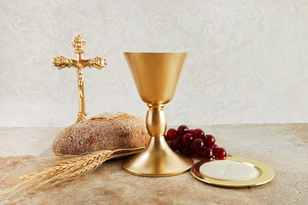 Easter communion still life with chalice of wine and bread