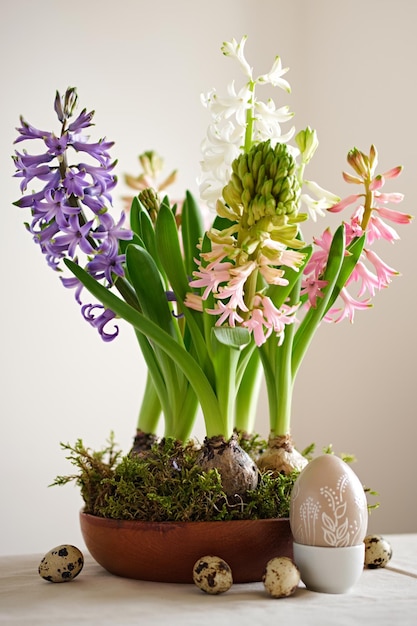 Easter composition from hyacinths flowers and quail eggs on linen tablecloth Zero Waste Easter