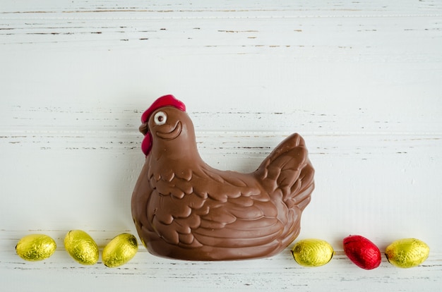 Easter composition with chocolate chicken and eggs