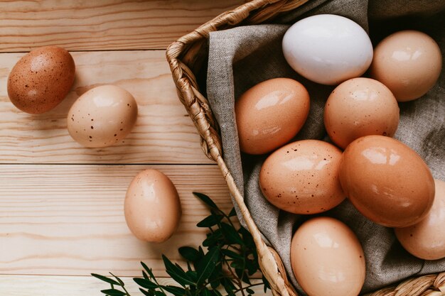 Easter composition with quail eggs on color wooden background Space for text