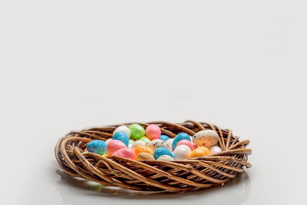 Easter concept wreath with easter eggs on a light background