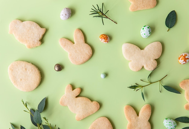 Easter cookies candies shaped eggs eucalyptus flowers and quail eggs Pattern