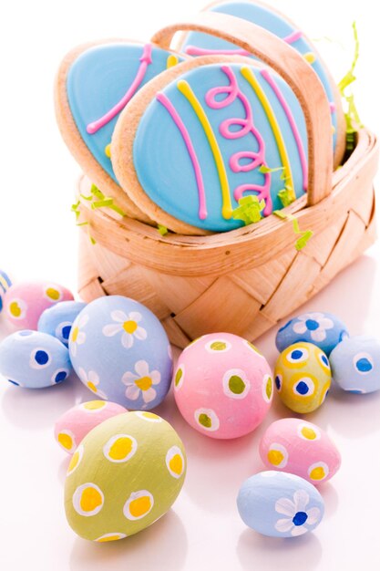 Easter cookies in shape of egg decorated with blue icing.