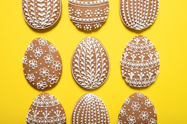 Easter cookies on a yellow surface. Easter eggs. Top view.