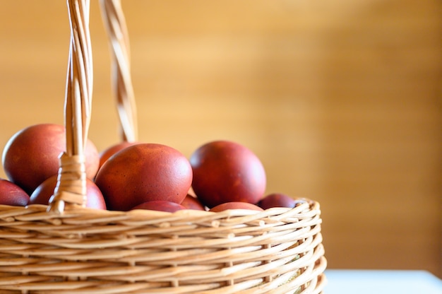 Easter egg painted onion husks in a wicker wooden basket