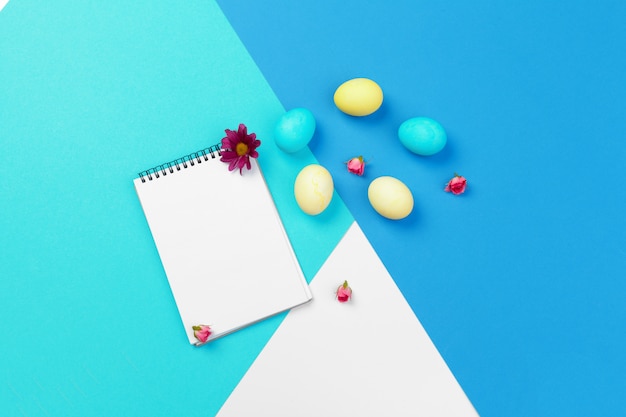 Easter eggs in blue colors. The place for the text on the paper